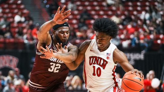 UNLV forward Jacob Bannarbie (10) drives towards the basket while guarded by Montana Te&rsquo;Jon Sawyer (32) during first half of college basketball game against Montana on Tuesday, Nov. 11, 2025 at Thomas and Mack Center in Las Vegas.