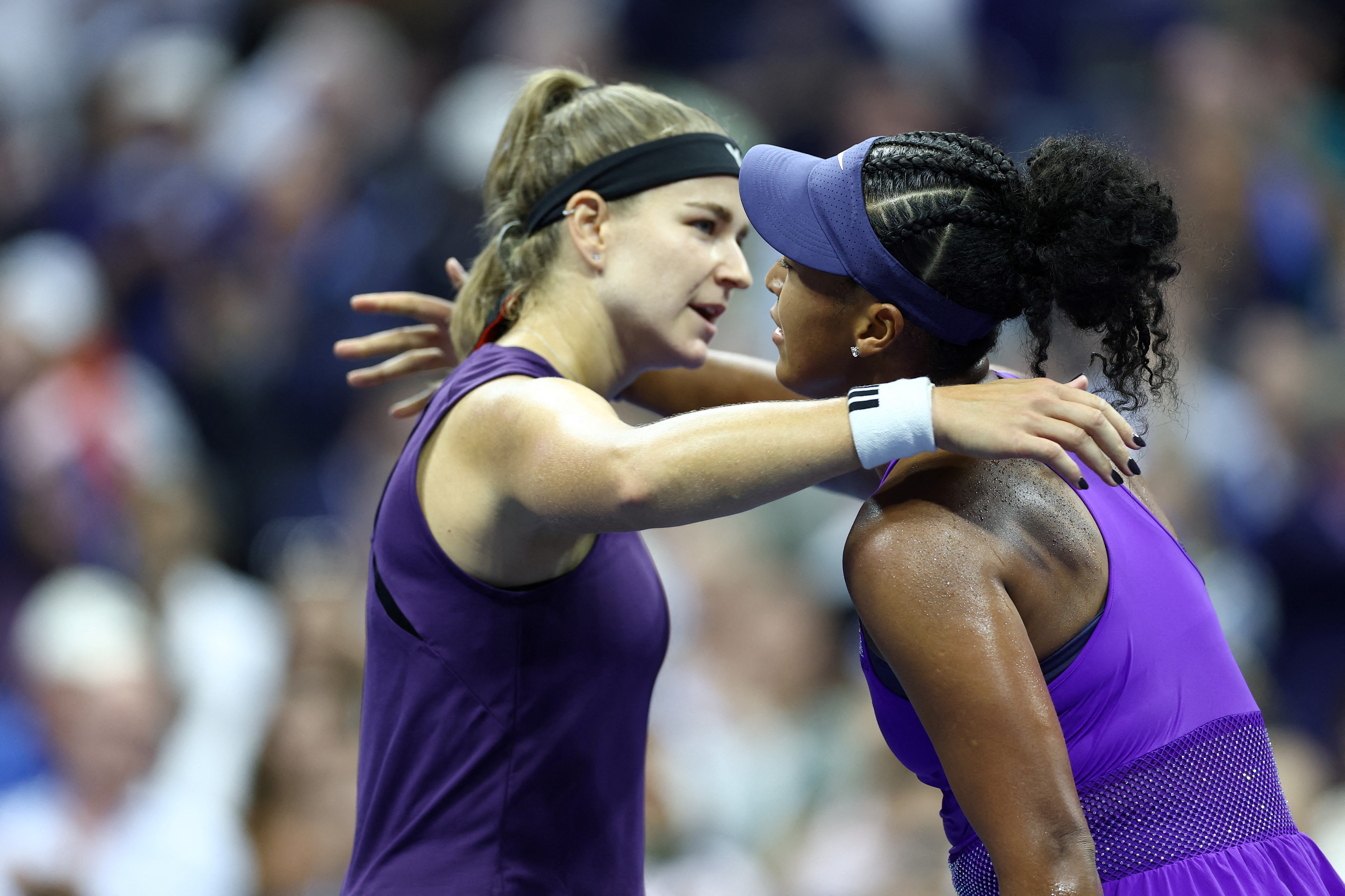 Japan's Naomi Osaka and Czech Republic's Karolina Muchova hug at the net after Osaka won their women's singles quarterfinal tennis match on day eleven of the US Open tennis tournament at the USTA Billie Jean King National Tennis Center in New York City on September 3, 2025. (Photo by CHARLY TRIBALLEAU / AFP)