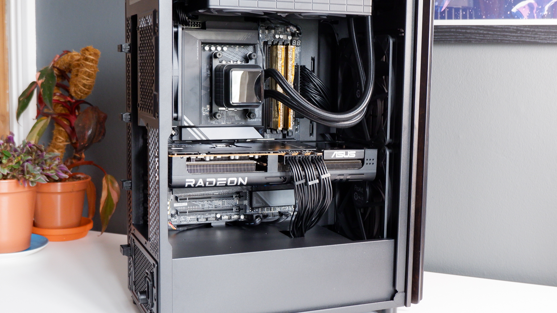 A gaming PC in the process of being built, using Radeon and Ryzen components and an Asus Pro Art PA401 PC case.