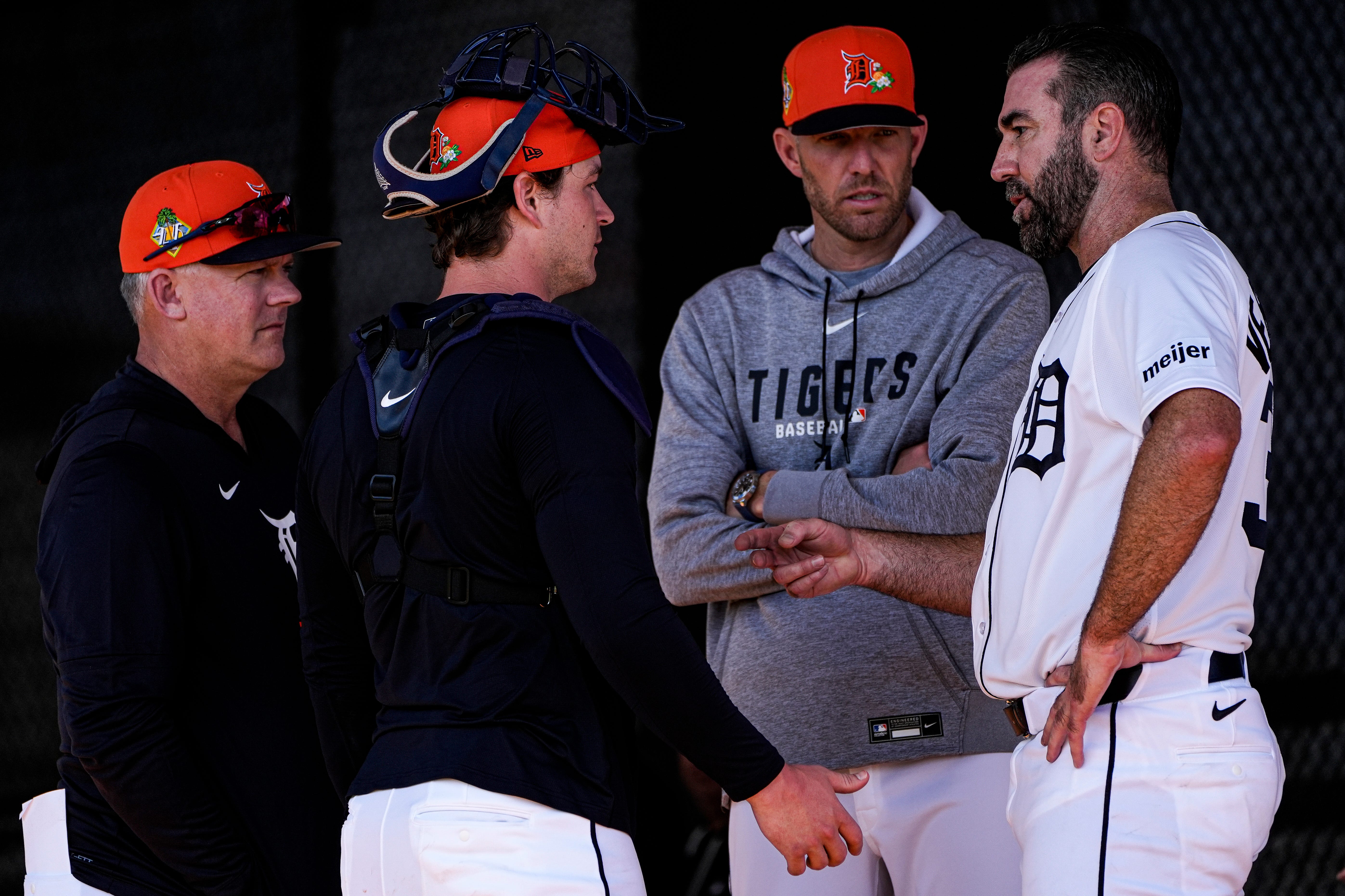 Detroit Tigers pitcher Justin Verlander, right, talks to pitching coach Chris Fetter, center right, catcher Dillon Dingler, and manager A.J. Hinch at practice during spring training at TigerTown in Lakeland, Fla. on Wednesday, Feb. 18, 2026.