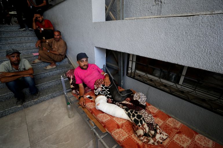 A wounded Palestinian lies on a bed at Al-Shifa Hospital, which Gaza's health ministry says is at risk of shutting down due to the Israeli blockade of fuel, in Gaza City July 9, 2025. REUTERS/Mahmoud Issa TPX IMAGES OF THE DAY