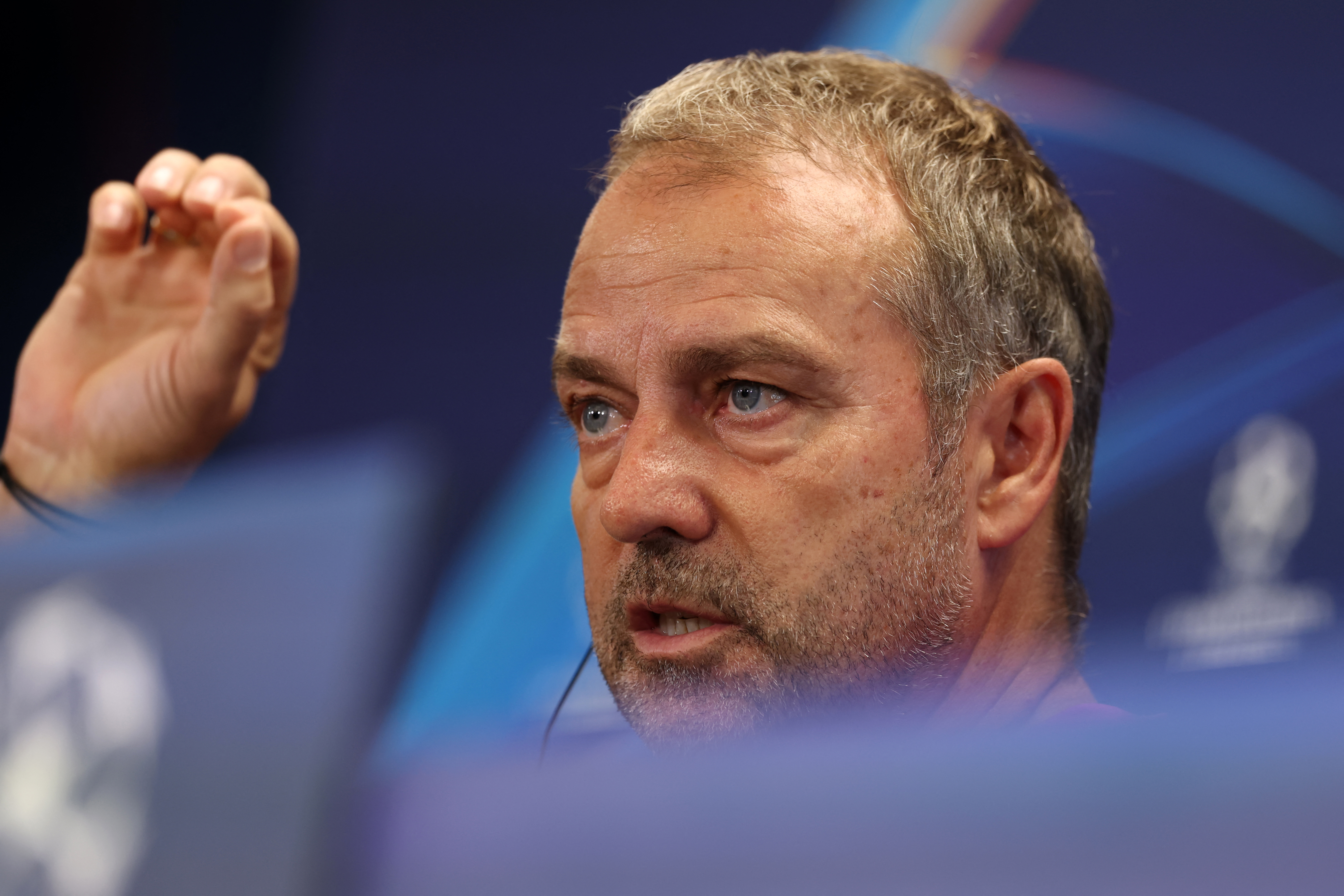 Barcelona's German coach Hans-Dieter Flick speask during a press conference on the eve of the UEFA Champions League league phase day 2 football match between FC Barcelona and Paris Saint-Germain (PSG) at the Joan Gamper training ground in Sant Joan Despi, near Barcelona, on September 30, 2025. (Photo by LLUIS GENE / AFP)