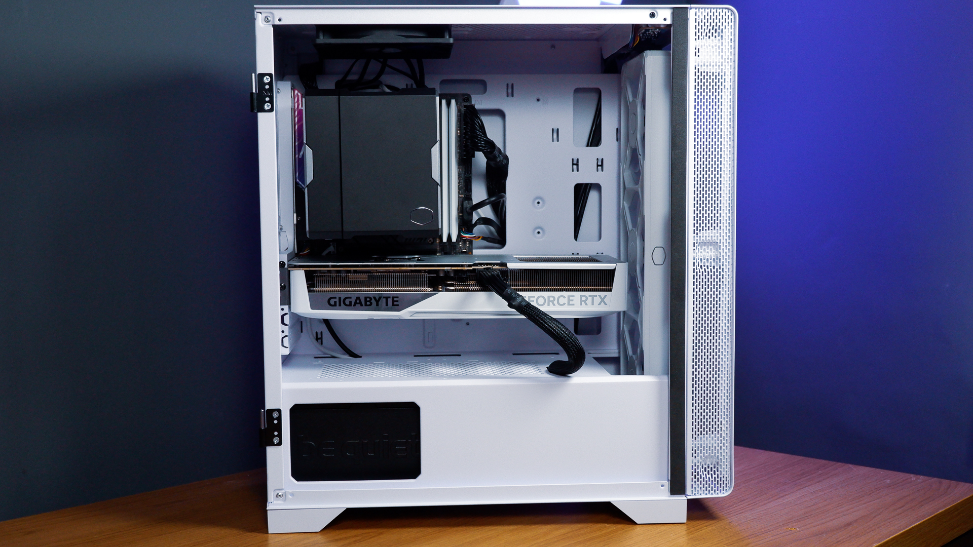 A white gaming PC built using a Thermaltake PC case, Cooler Master fans, and an AMD CPU.