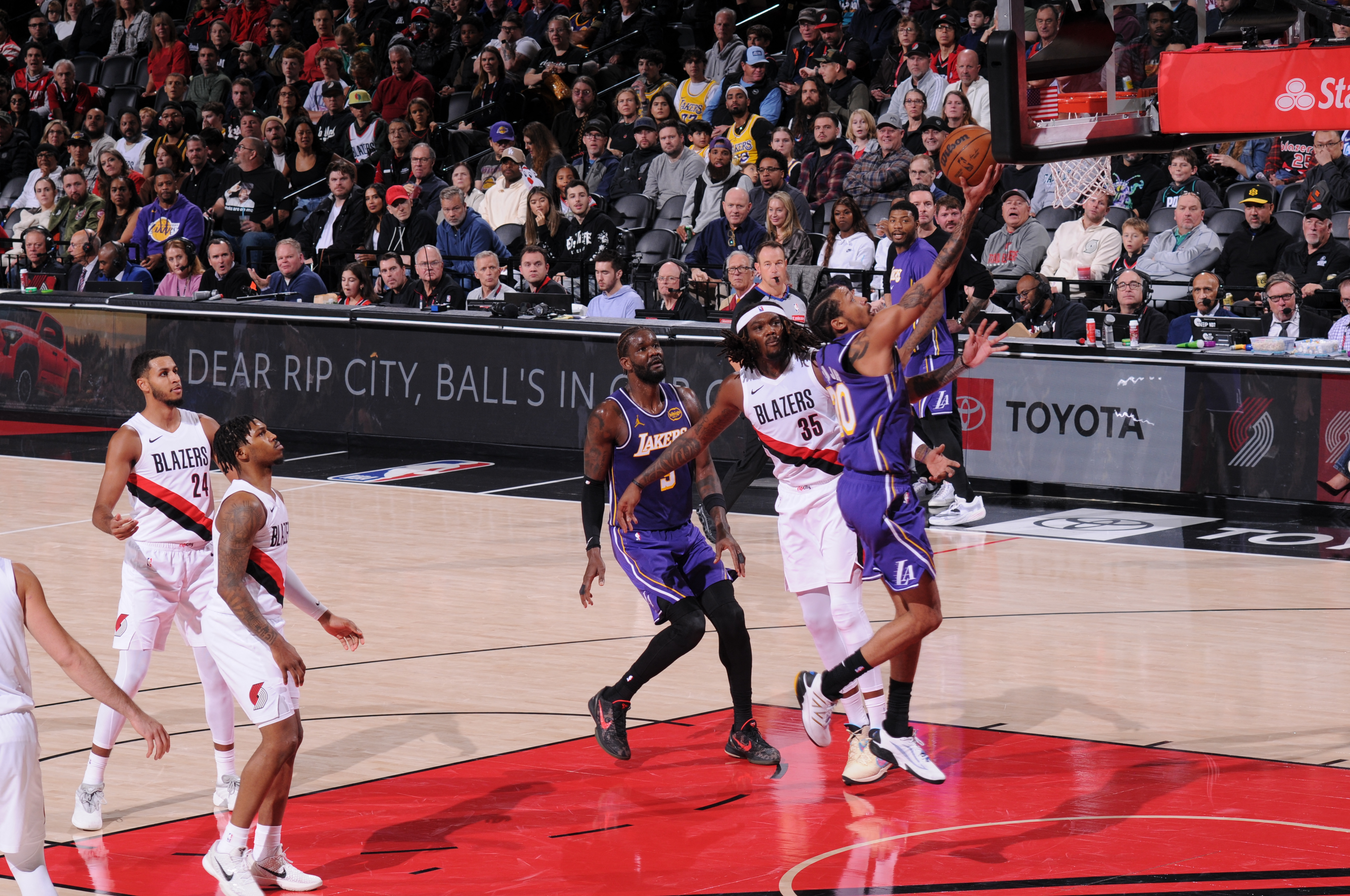 PORTLAND, OR - NOVEMBER 3: Nick Smith Jr. #20 of the Los Angeles Lakers drives to the basket during the game against the Portland Trail Blazers on November 3, 2025 at the Moda Center Arena in Portland, Oregon. NOTE TO USER: User expressly acknowledges and agrees that, by downloading and or using this photograph, user is consenting to the terms and conditions of the Getty Images License Agreement. Mandatory Copyright Notice: Copyright 2025 NBAE Cameron Browne/NBAE via Getty Images/AFP (Photo by Cameron Browne / NBAE / Getty Images / Getty Images via AFP)