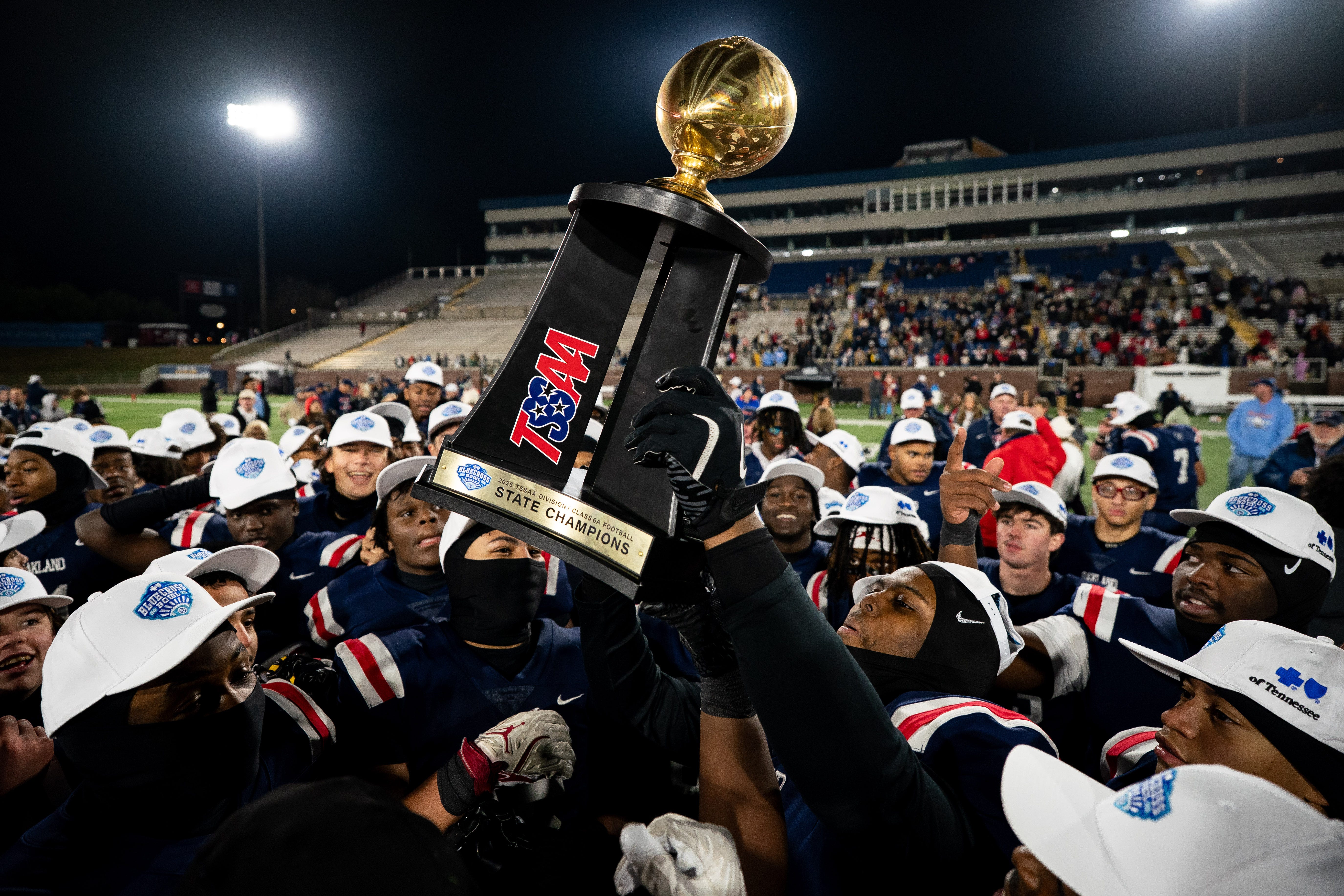 Oakland celebrates with their trophy after defeating Ravenwood in the Class 6A championship at Finley Stadium in Chattanooga, Tenn., Saturday, Dec. 6, 2025.